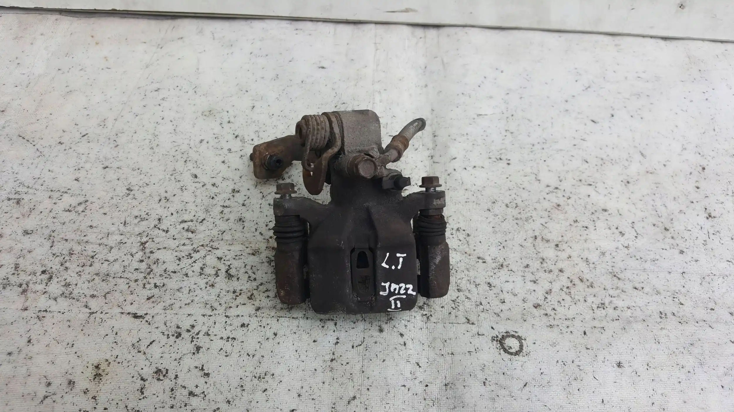 ZACISK LEWY TYŁ TYLNY HONDA JAZZ II 02-